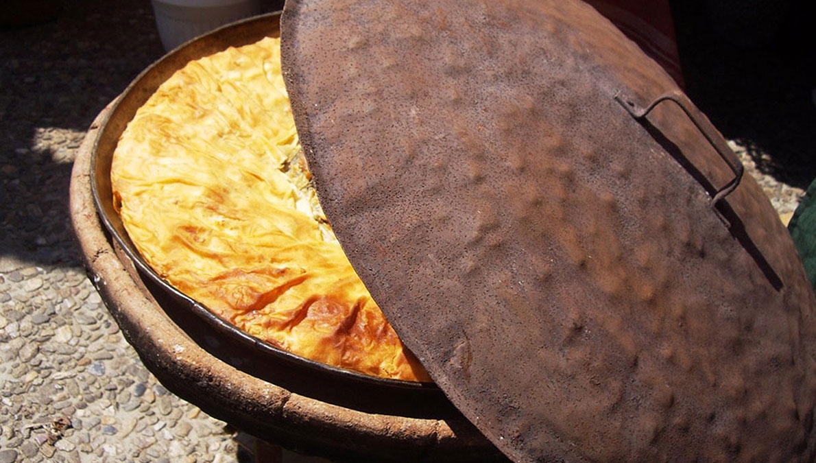 Spiral/layered banitsa with cheese baked under vrashnik
